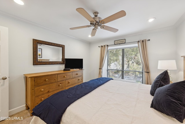 carpeted bedroom featuring crown molding and ceiling fan