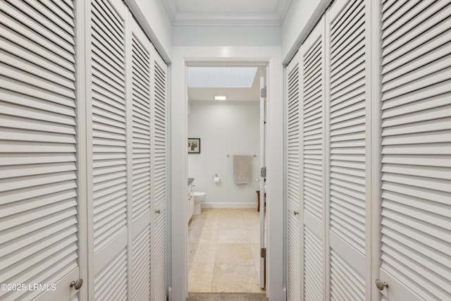 hallway featuring crown molding