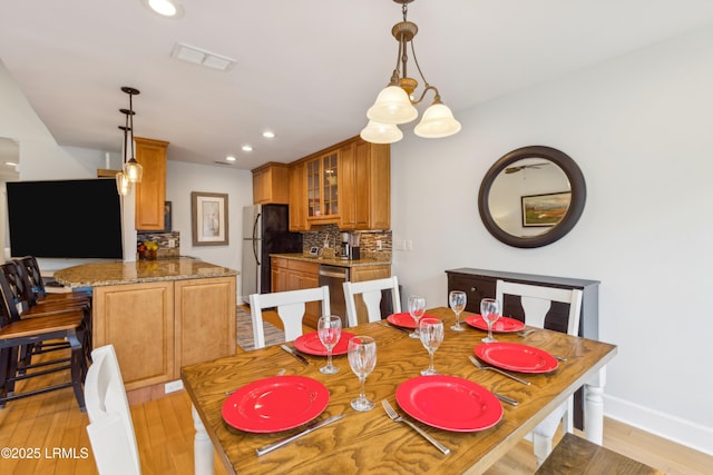 dining space featuring light hardwood / wood-style floors