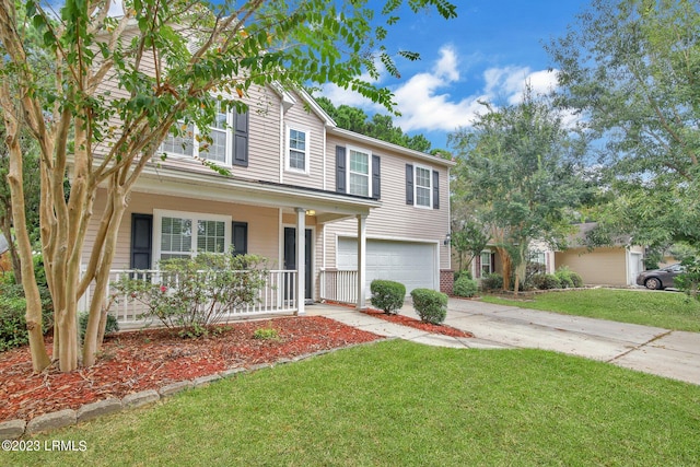 7 Harbison Pl, Beaufort, SC 29906 - traditional home with covered porch, an attached garage, concrete driveway, and a front yard
