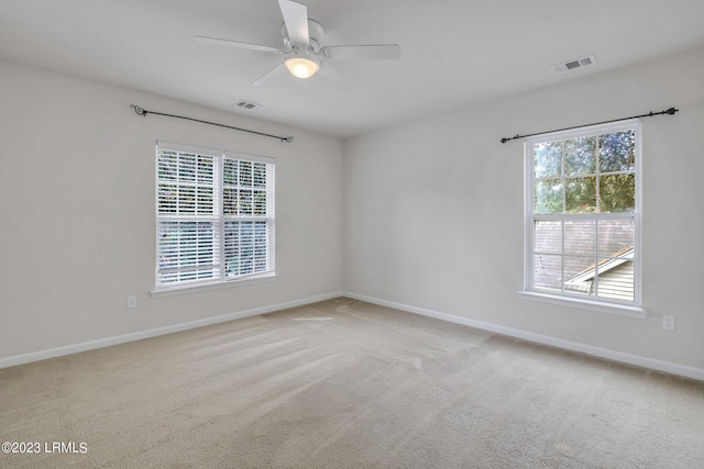 7 Harbison Pl, Beaufort, SC 29906 - spare room featuring plenty of natural light, ceiling fan, and carpet flooring