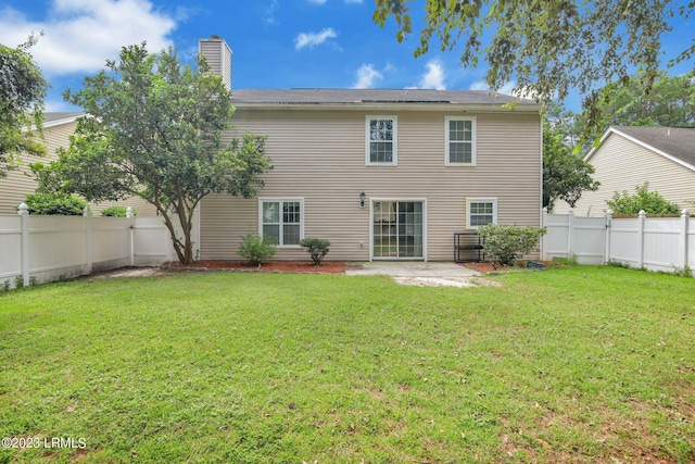 7 Harbison Pl, Beaufort, SC 29906 - rear view of house featuring a fenced backyard, a chimney, and a patio