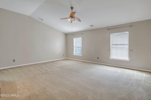 7 Harbison Pl, Beaufort, SC 29906 - spare room featuring vaulted ceiling, light colored carpet, and a ceiling fan