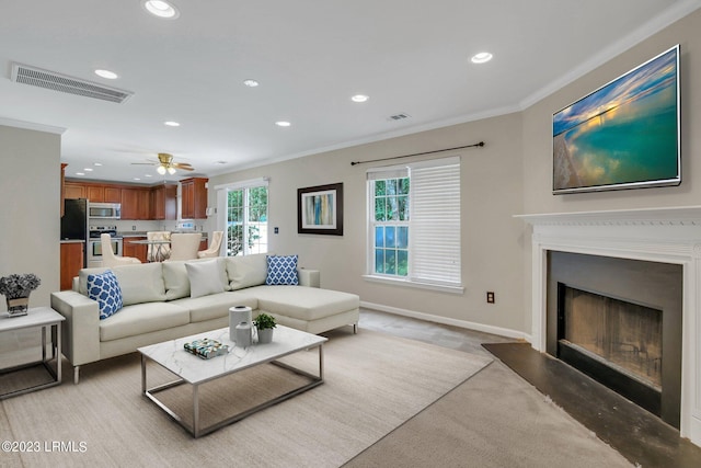 7 Harbison Pl, Beaufort, SC 29906 - living room featuring recessed lighting, ornamental molding, a fireplace, ceiling fan, and light colored carpet