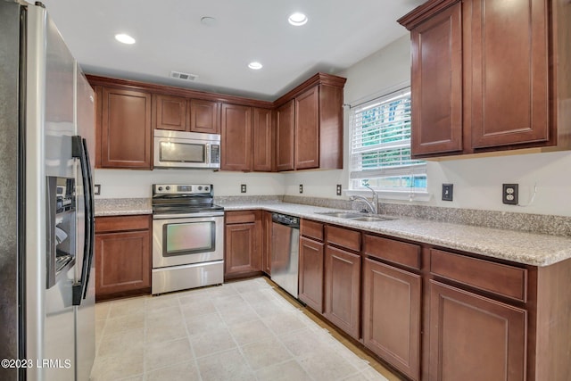 7 Harbison Pl, Beaufort, SC 29906 - kitchen featuring stainless steel appliances, recessed lighting, light countertops, and light tile patterned floors
