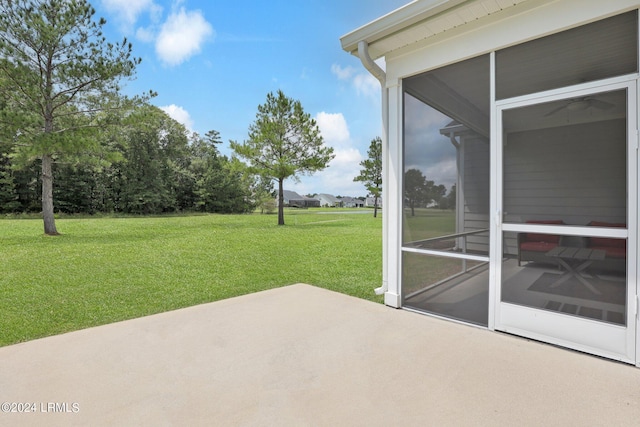 view of patio with a sunroom