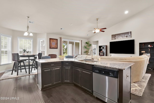 kitchen with pendant lighting, sink, stainless steel dishwasher, and a center island with sink