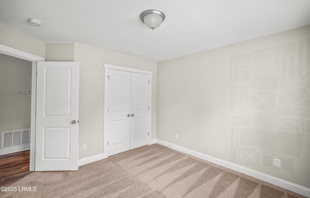 28 Laughing Gull Dr, Beaufort, SC 29907 - unfurnished bedroom featuring a closet, carpet flooring, and baseboards