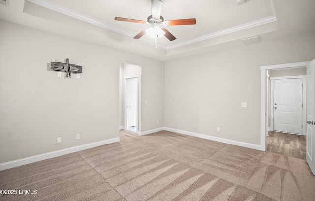 28 Laughing Gull Dr, Beaufort, SC 29907 - carpeted empty room featuring a raised ceiling, ornamental molding, a ceiling fan, baseboards, and a smoke detector