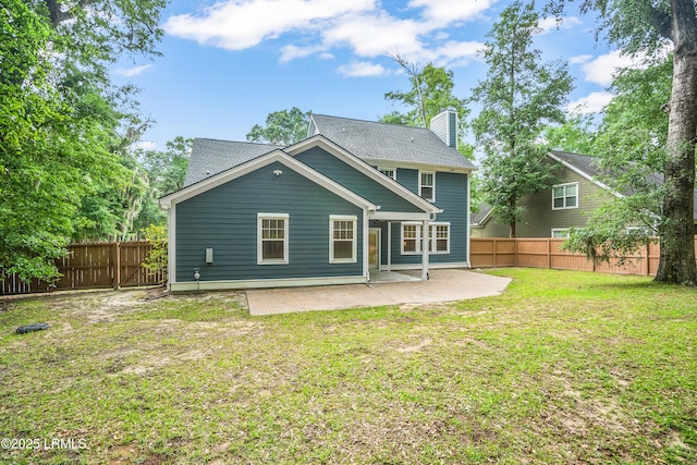 28 Laughing Gull Dr, Beaufort, SC 29907 - back of property featuring a patio, a chimney, and roof with shingles