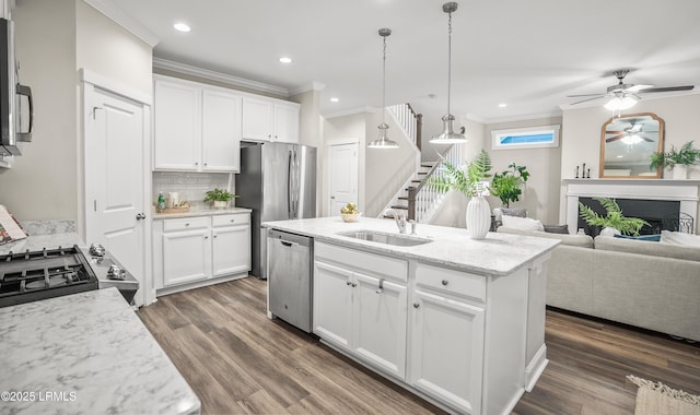 28 Laughing Gull Dr, Beaufort, SC 29907 - kitchen featuring a sink, appliances with stainless steel finishes, a ceiling fan, ornamental molding, and backsplash
