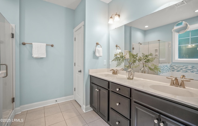 28 Laughing Gull Dr, Beaufort, SC 29907 - full bathroom with a shower stall, double vanity, tile patterned floors, and baseboards