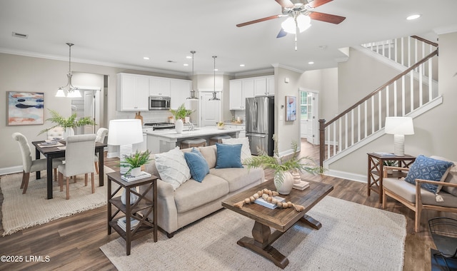 28 Laughing Gull Dr, Beaufort, SC 29907 - living room featuring a ceiling fan, stairs, baseboards, dark wood finished floors, and ornamental molding