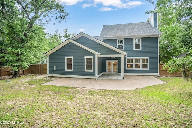 28 Laughing Gull Dr, Beaufort, SC 29907 - rear view of house with a patio, a chimney, and french doors