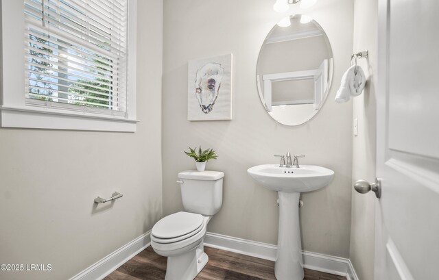 28 Laughing Gull Dr, Beaufort, SC 29907 - half bath featuring baseboards, toilet, wood finished floors, and a sink