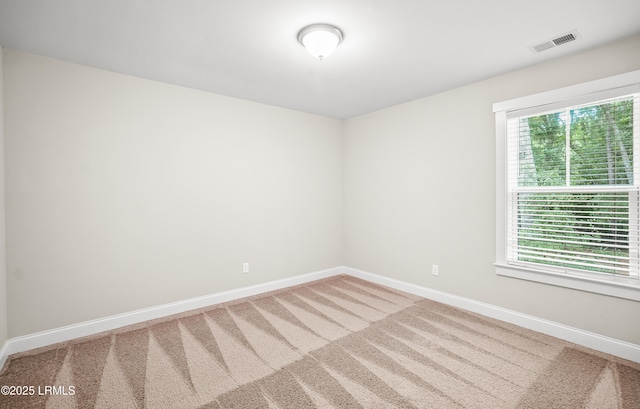 28 Laughing Gull Dr, Beaufort, SC 29907 - spare room with baseboards and carpet flooring