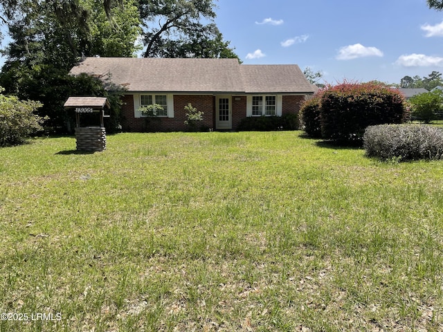13005 Gail St, Beaufort, SC 29906 - view of front of property featuring a front lawn and brick siding