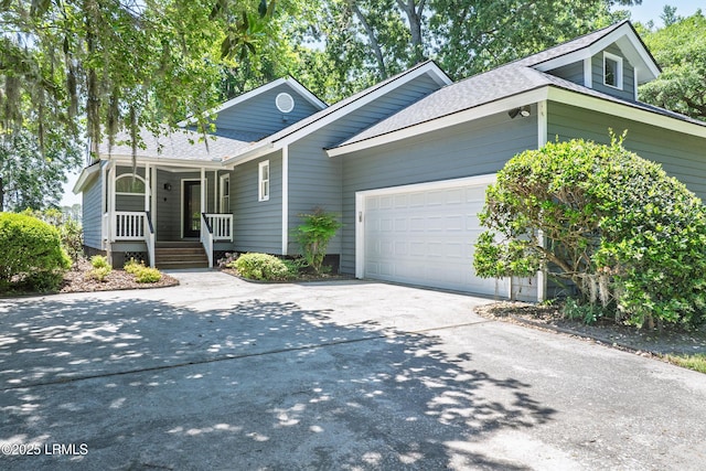 6 River Marsh Ln, Okatie, SC 29909 - single story home with a shingled roof, covered porch, driveway, and an attached garage