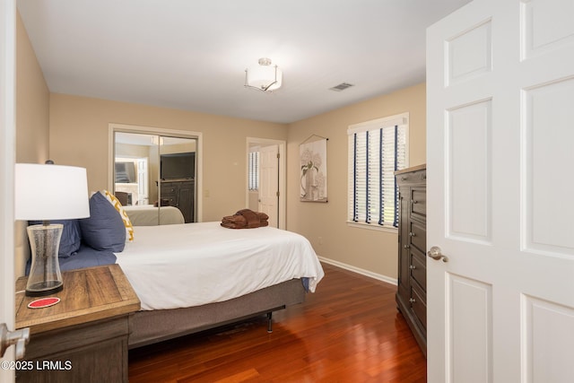 6 River Marsh Ln, Okatie, SC 29909 - bedroom featuring baseboards and dark wood-style flooring