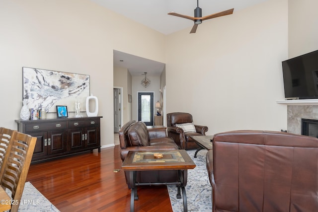 6 River Marsh Ln, Okatie, SC 29909 - living area featuring wood finished floors, a high ceiling, a ceiling fan, a fireplace, and baseboards