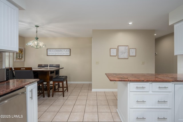 6 River Marsh Ln, Okatie, SC 29909 - kitchen with baseboards, white cabinets, light tile patterned floors, recessed lighting, and stainless steel dishwasher