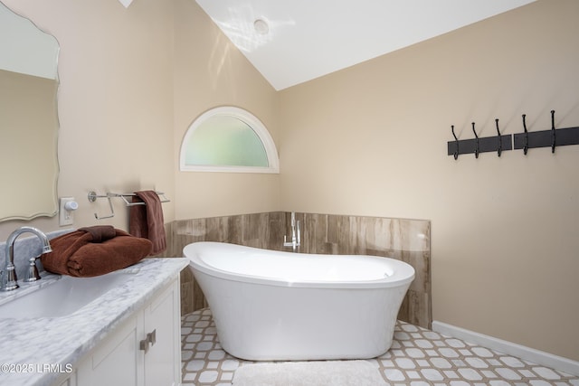 6 River Marsh Ln, Okatie, SC 29909 - full bath with tile patterned floors, vanity, a freestanding tub, and lofted ceiling