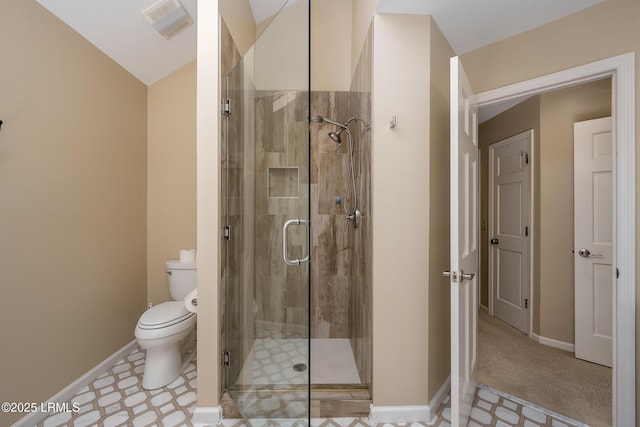 6 River Marsh Ln, Okatie, SC 29909 - bathroom with a shower stall, toilet, baseboards, and vaulted ceiling