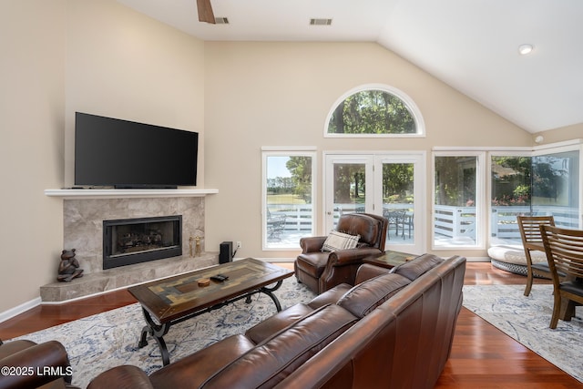 6 River Marsh Ln, Okatie, SC 29909 - living room featuring a fireplace, high vaulted ceiling, and dark wood-style flooring