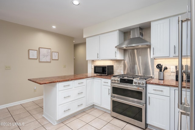 6 River Marsh Ln, Okatie, SC 29909 - kitchen with double oven range, wall chimney exhaust hood, a peninsula, decorative backsplash, and recessed lighting