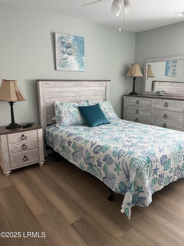 bedroom featuring wood-type flooring and ceiling fan