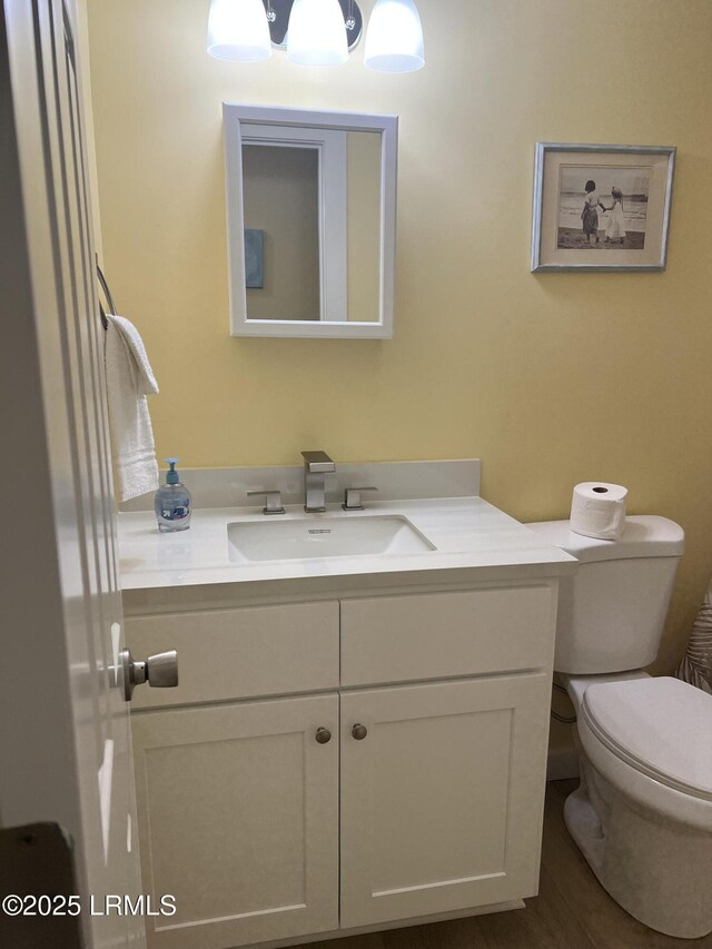 169 Beach Club Villa Dr, Fripp Island, SC 29920 - bathroom with toilet, shower / tub combo with curtain, and wood finished floors