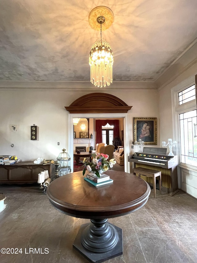 901 7th St W, Fairfax, SC 29827 - dining area with ornamental molding, a healthy amount of sunlight, and a chandelier