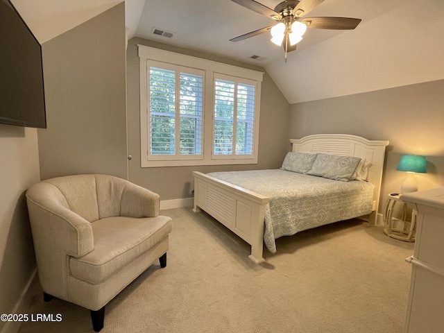 bedroom featuring light colored carpet, visible vents, a ceiling fan, vaulted ceiling, and baseboards