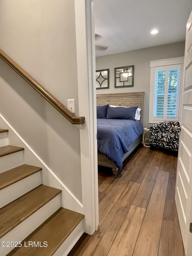 bedroom featuring wood finished floors and recessed lighting