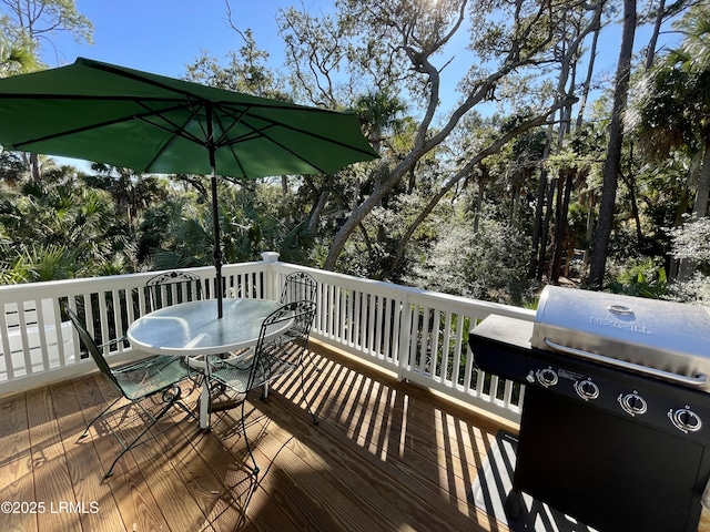 wooden terrace featuring grilling area