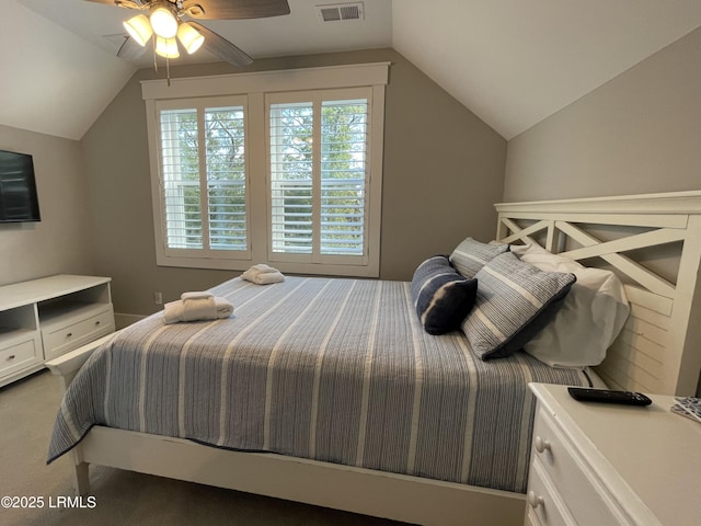 bedroom with visible vents, vaulted ceiling, and a ceiling fan