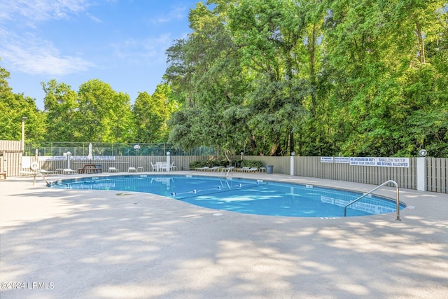 view of pool featuring a patio