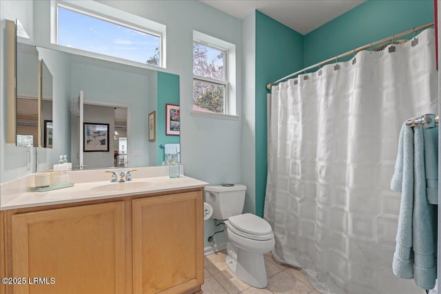 full bath featuring toilet, tile patterned flooring, a shower with shower curtain, and vanity