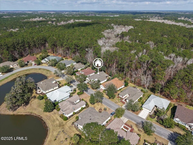 bird's eye view featuring a water view and a view of trees