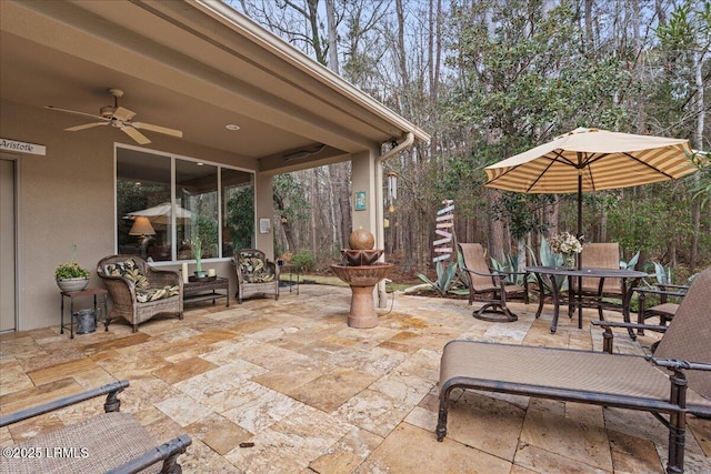 view of patio / terrace featuring ceiling fan and outdoor dining space