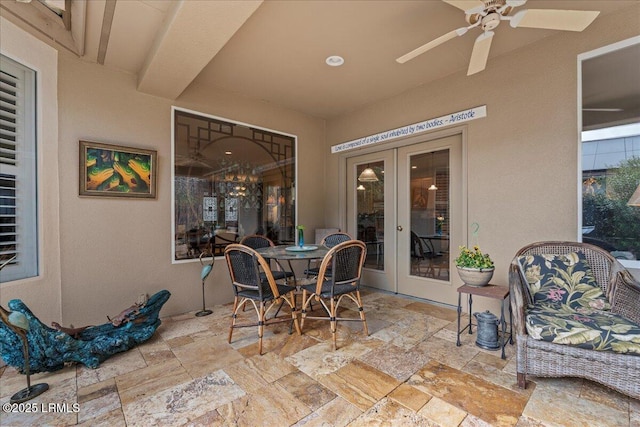 view of patio featuring a ceiling fan and outdoor dining space