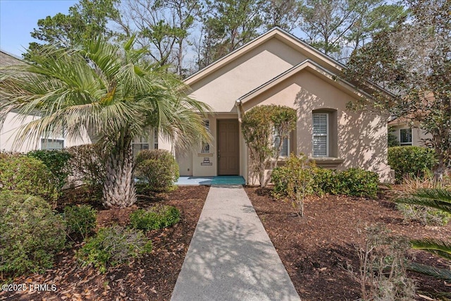 view of front of house featuring stucco siding