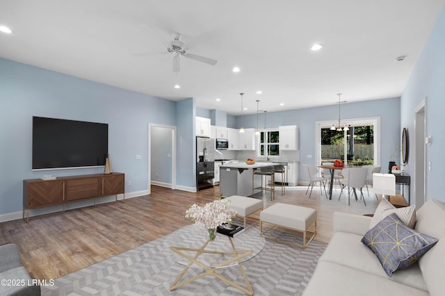 95 Salkehatchie Rd, Yemassee, SC 29945 - living area featuring light wood finished floors, a ceiling fan, recessed lighting, baseboards, and a chandelier