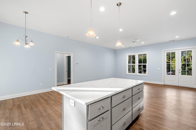95 Salkehatchie Rd, Yemassee, SC 29945 - kitchen featuring gray cabinets, open floor plan, dark wood finished floors, a chandelier, and a kitchen island