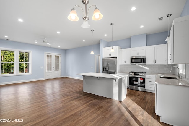 95 Salkehatchie Rd, Yemassee, SC 29945 - kitchen with stainless steel appliances, a sink, backsplash, dark wood-style flooring, and ceiling fan