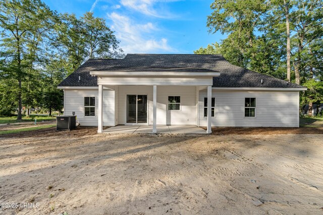 95 Salkehatchie Rd, Yemassee, SC 29945 - rear view of house featuring central AC unit, a patio area, and roof with shingles