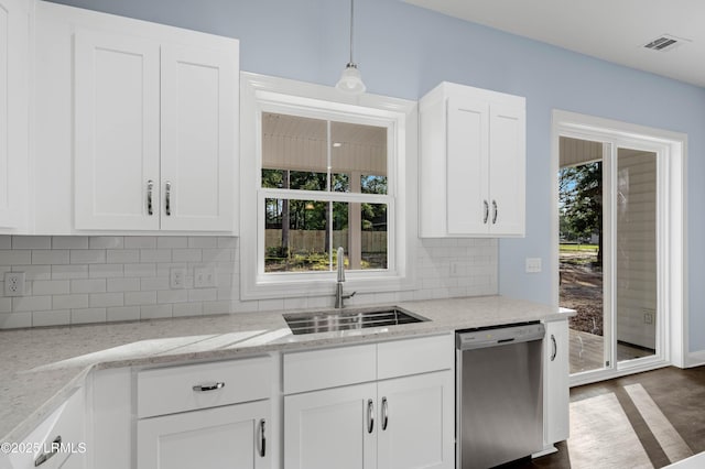 95 Salkehatchie Rd, Yemassee, SC 29945 - kitchen with dishwasher, a sink, white cabinets, and backsplash