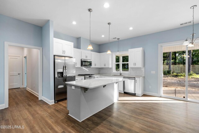 95 Salkehatchie Rd, Yemassee, SC 29945 - kitchen featuring stainless steel appliances, a sink, tasteful backsplash, baseboards, and dark wood-style floors