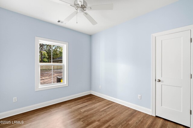 95 Salkehatchie Rd, Yemassee, SC 29945 - empty room with wood finished floors, baseboards, and ceiling fan