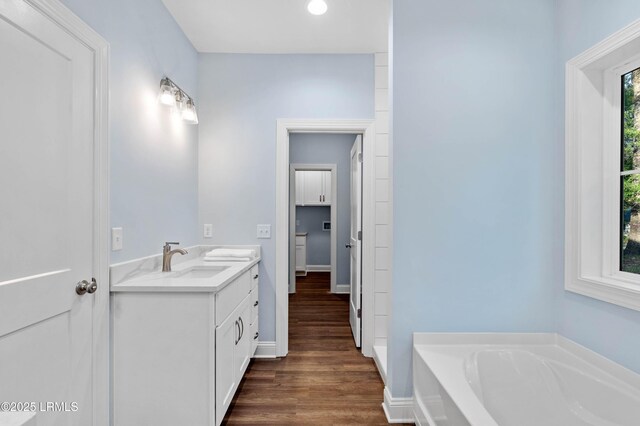 95 Salkehatchie Rd, Yemassee, SC 29945 - bathroom with vanity, a bath, wood finished floors, baseboards, and recessed lighting
